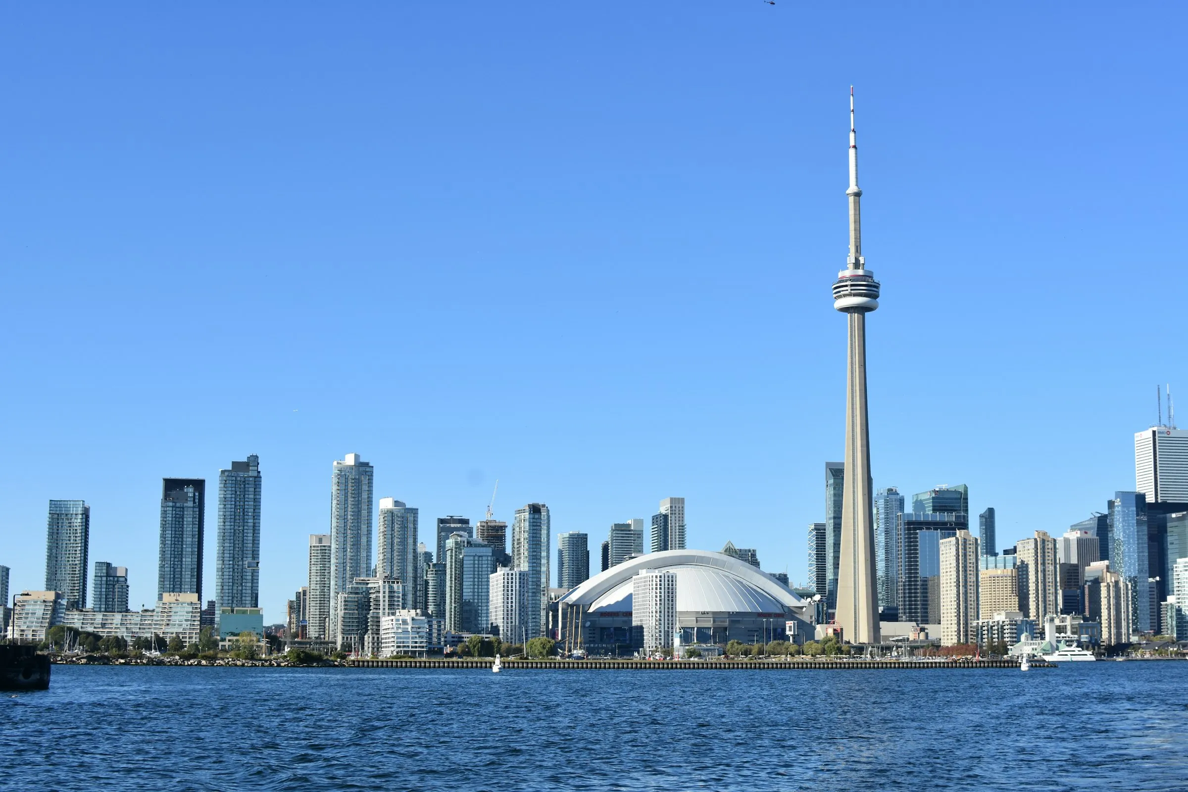 Toronto skyline with the CN Tower, viewed across the water on a bright day